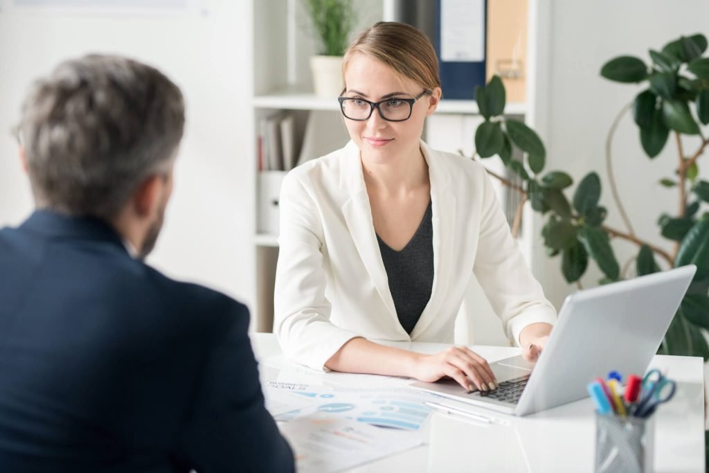 content-attractive-female-business-consultant-working-with-clien-1.jpg