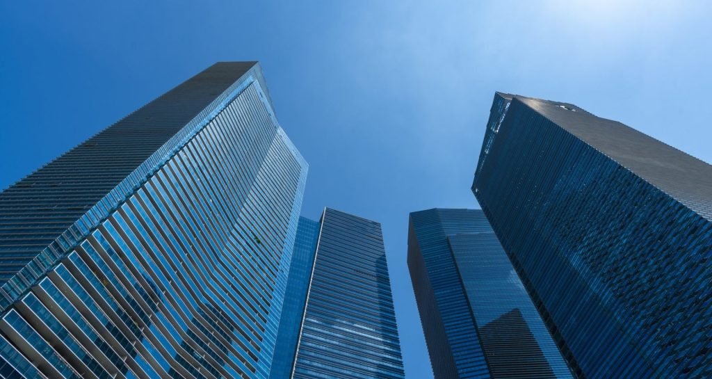 skyline-of-singapore-city-downtown-skyscrapers-office-buildings-e1640533982433.jpg